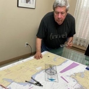 Bob Rein working with navigation charts